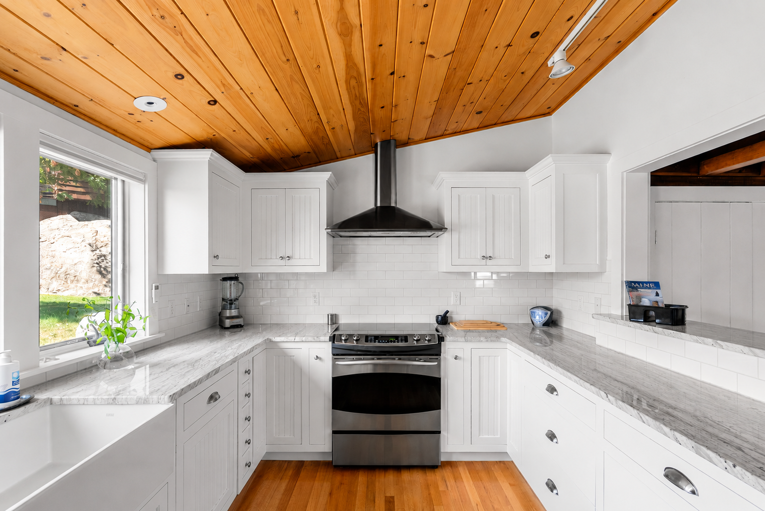 The kitchen has ample counter space and storage for meal prep.