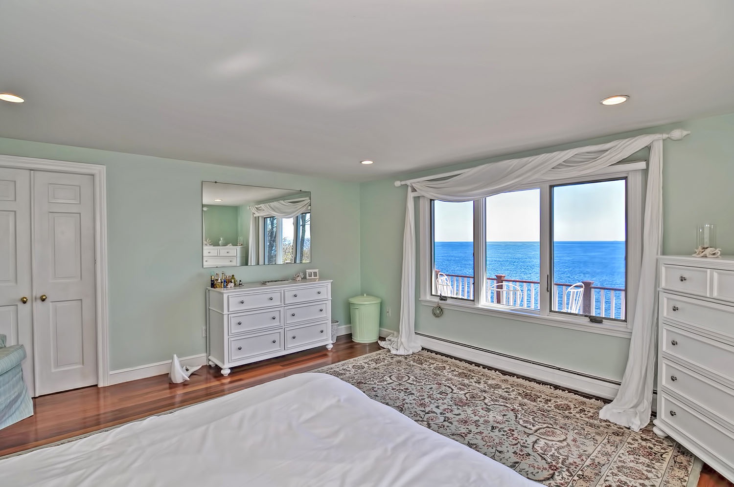 The primary bedroom has a glorious ocean view.