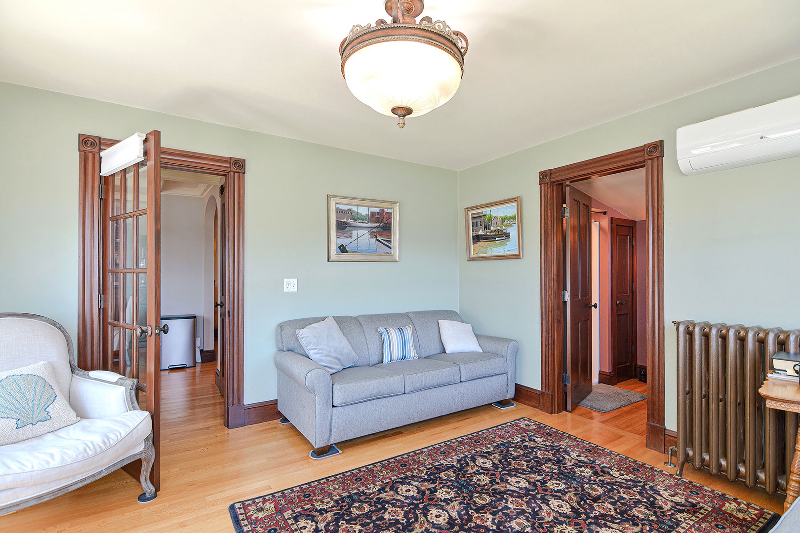 The living room with a full bathroom adjacent.