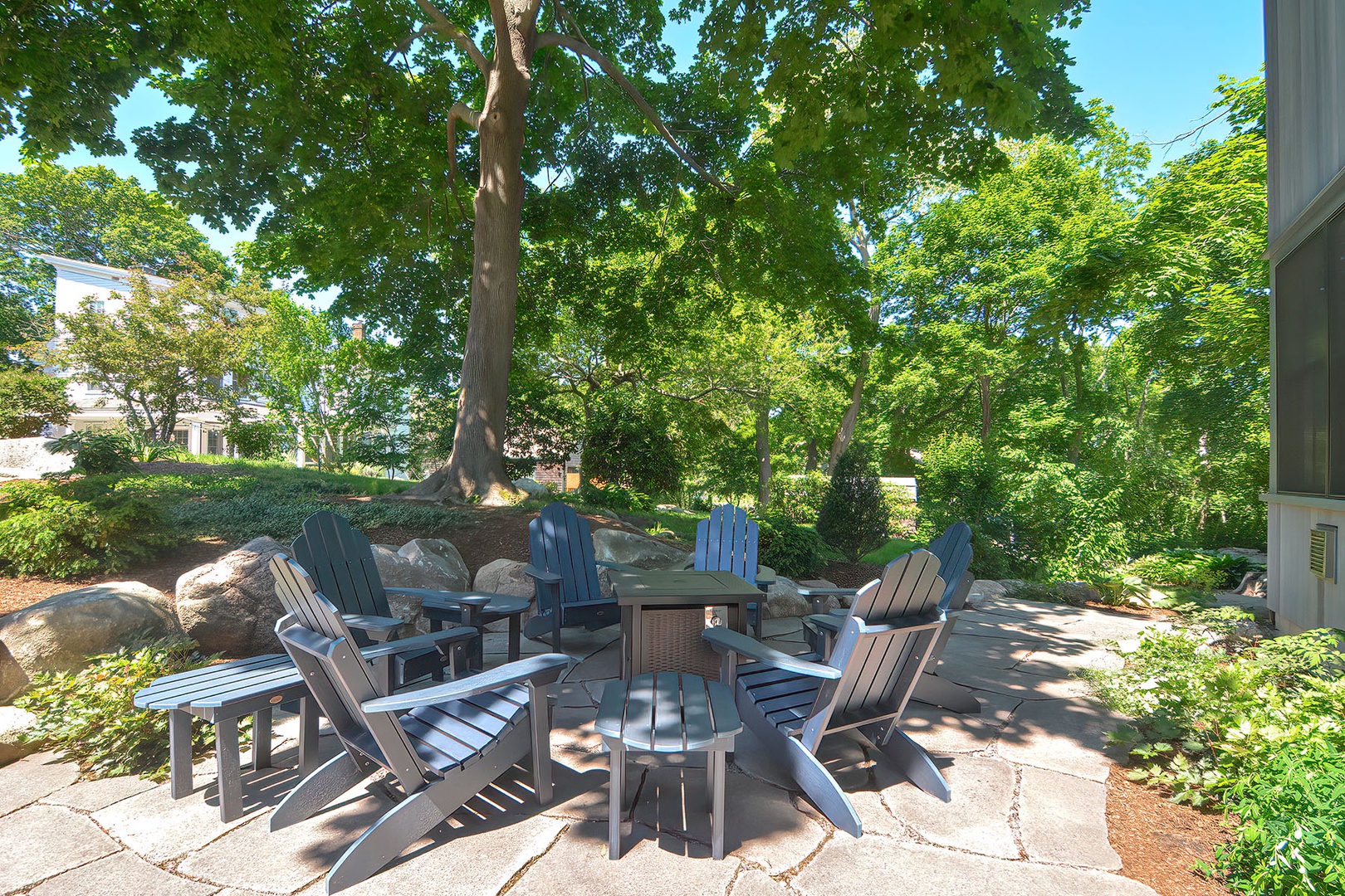 Enjoy the lush and shady patio at the front of the house.