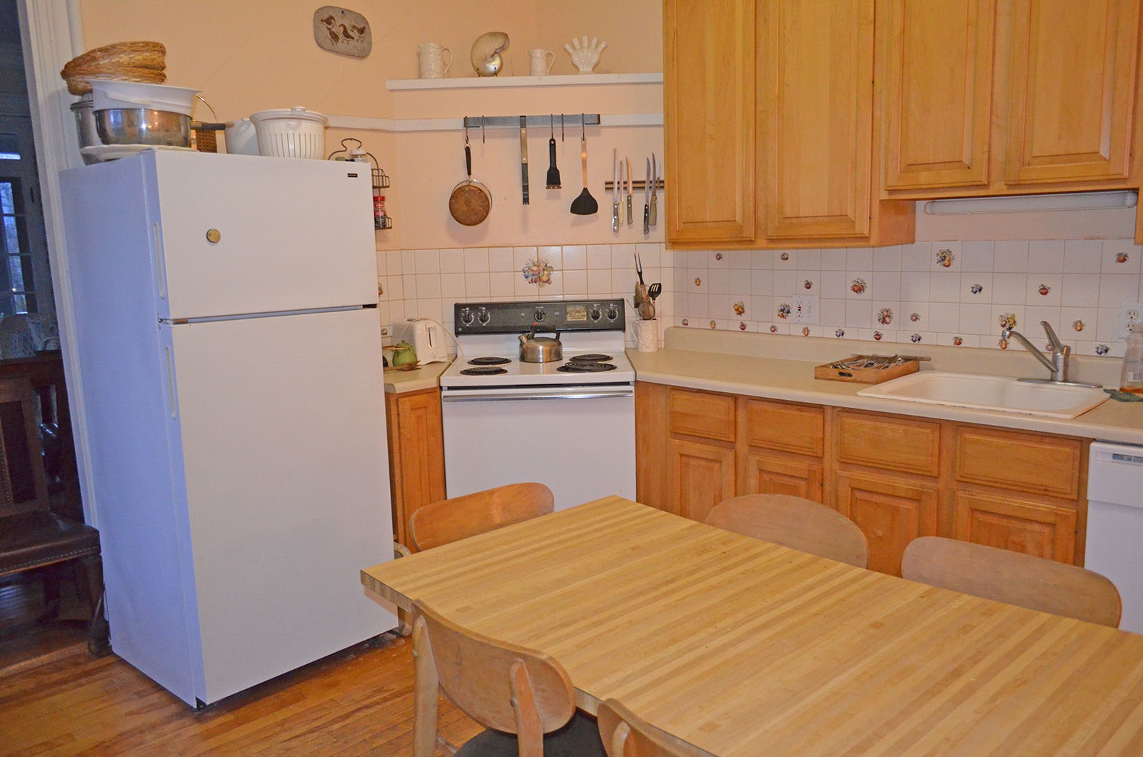 The eat-in kitchen has a table for six.