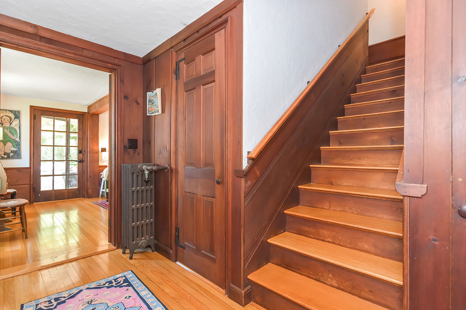 Staircase to and from 2nd level (between living room and dining room)..