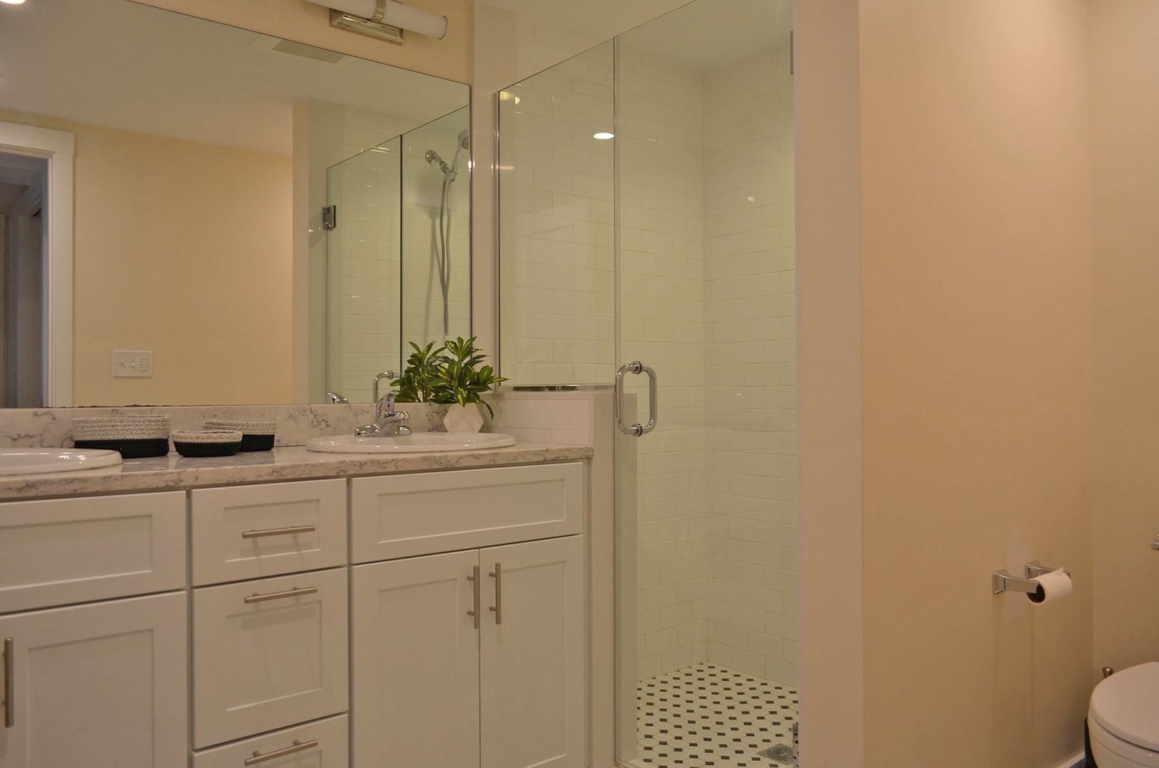 The full bath with walk-in tiled shower.