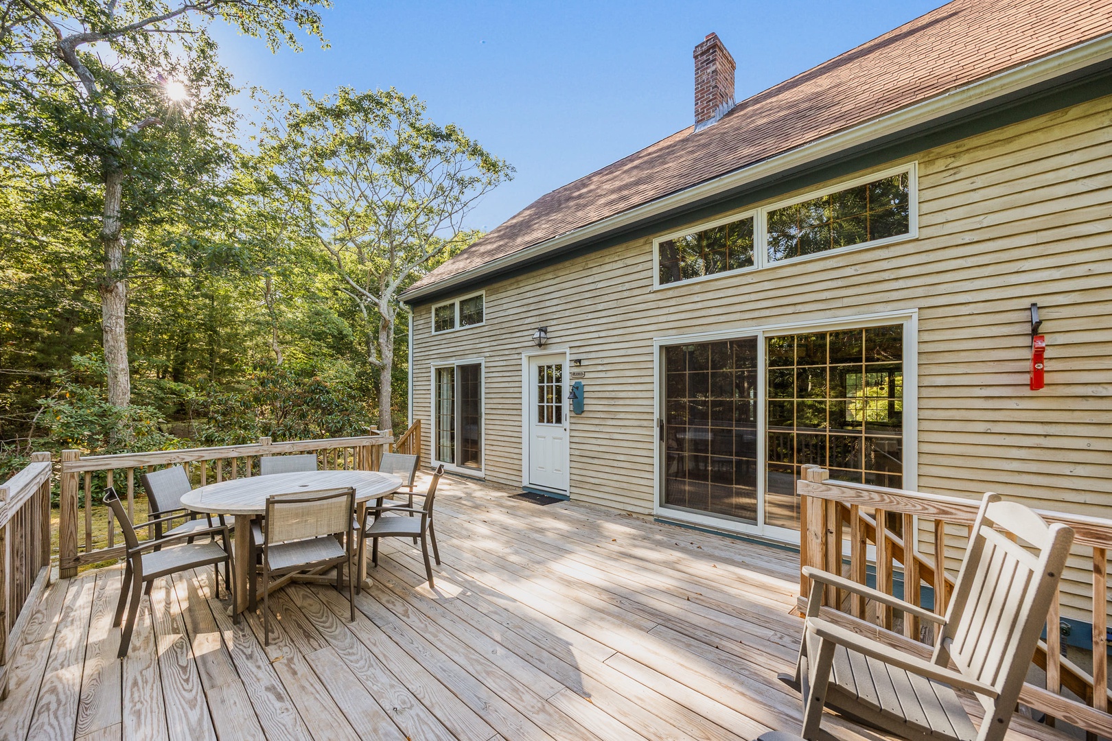 The spacious deck surrounded by greenery.