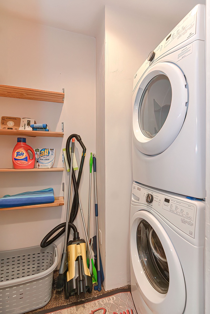 The laundry room with washer and dryer units.