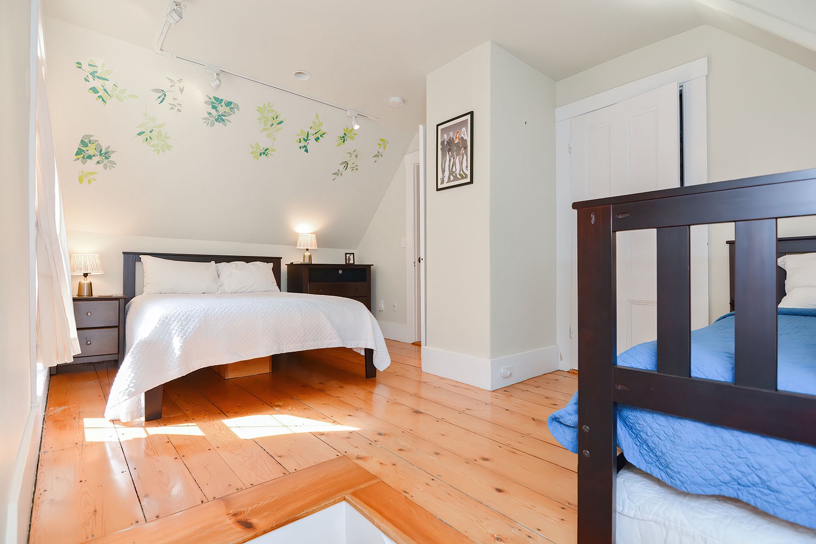 BR 3: Shared bedroom with a full bed and a twin trundle bed.