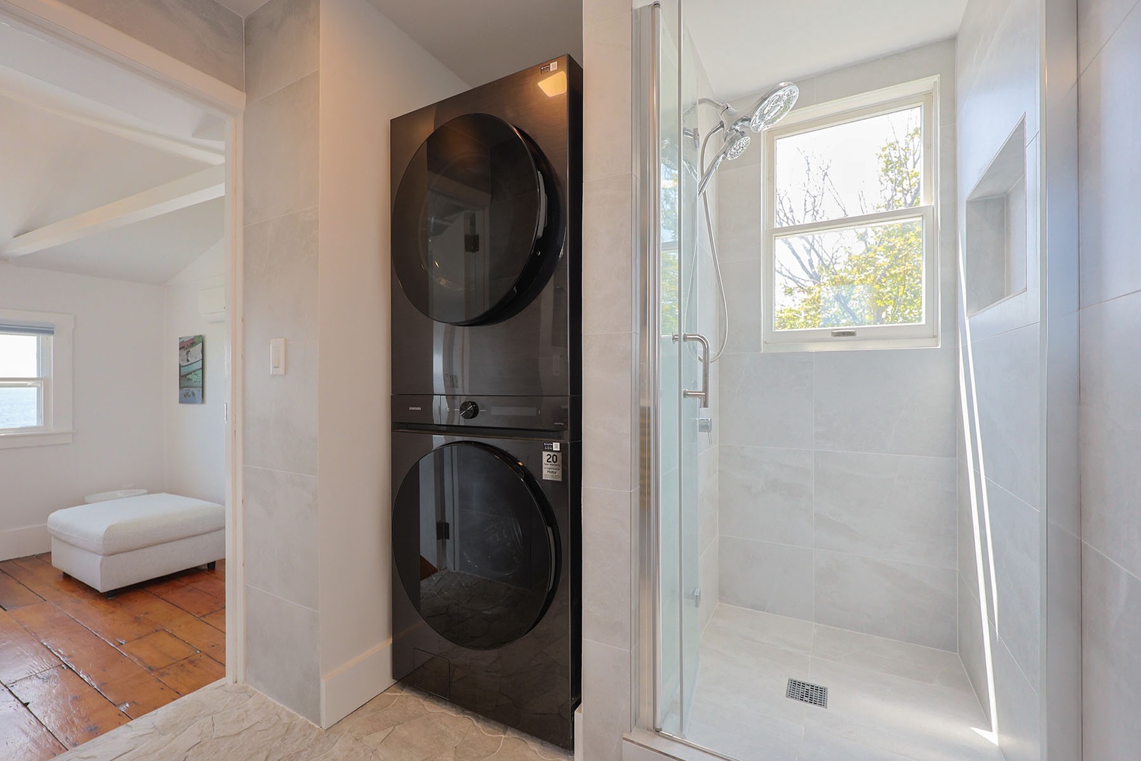 The washer and dryer are also located in the upstairs bathroom.