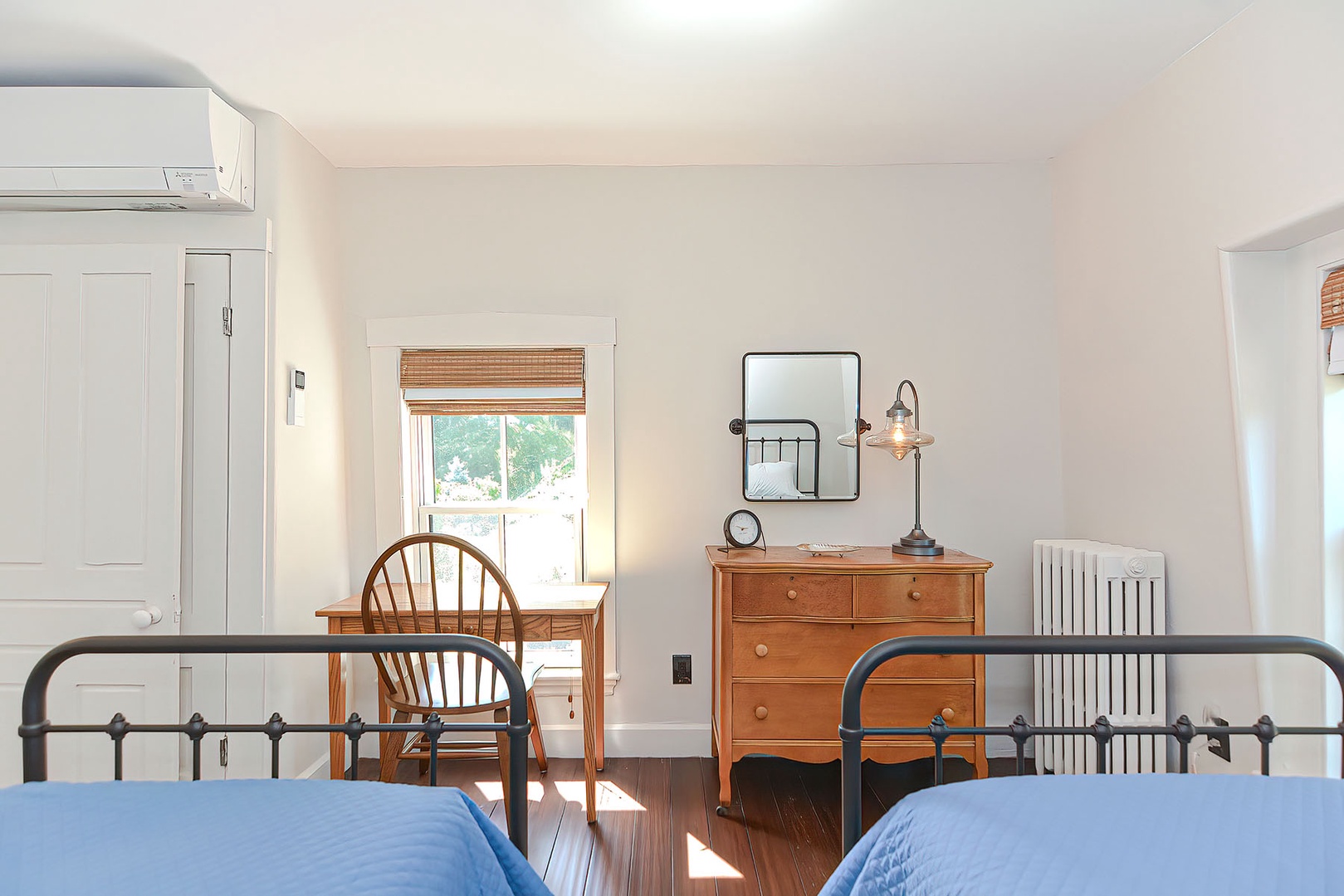 There is a workspace in the twin bedroom.