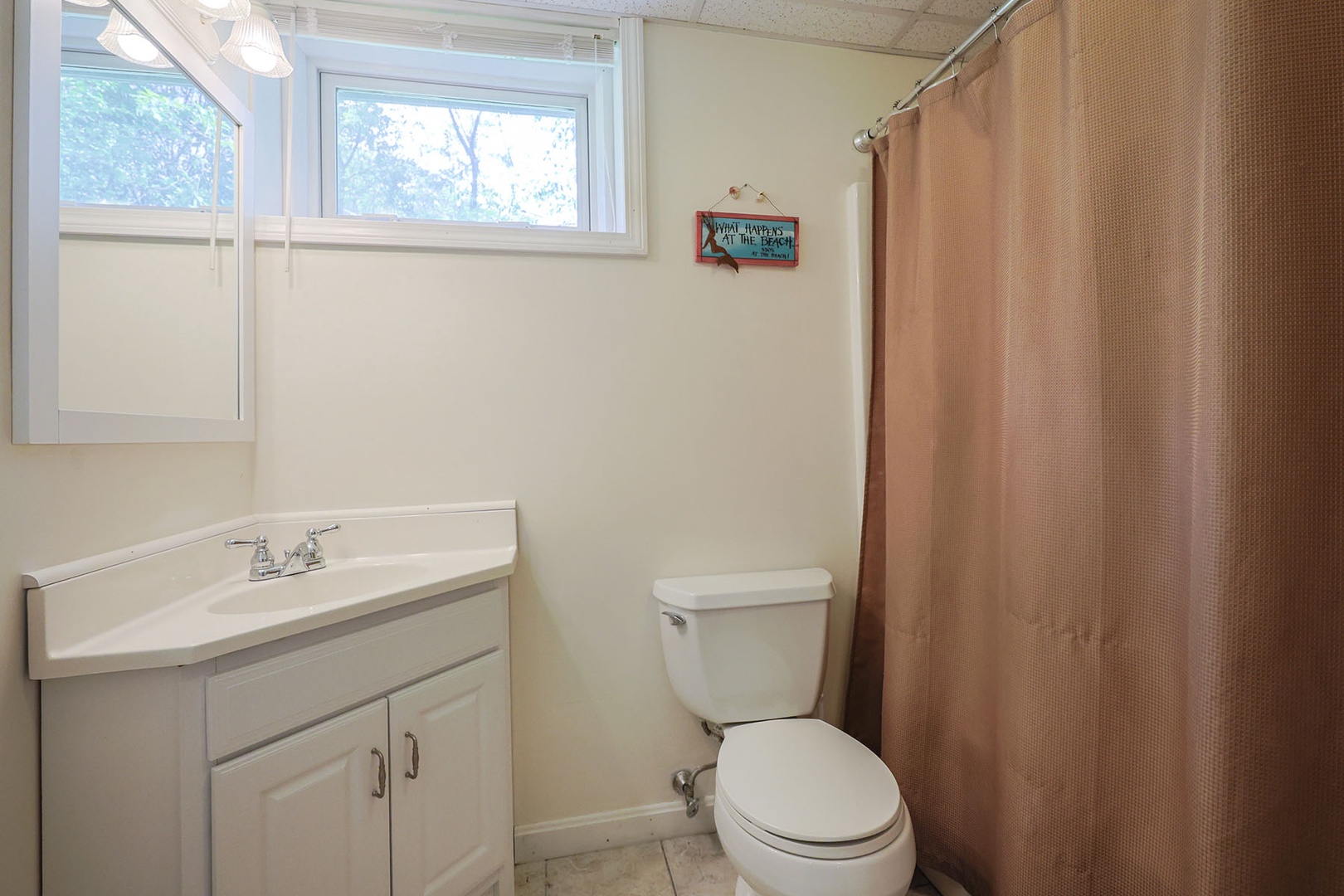 The full bathroom on this level comes with a combo tub and shower