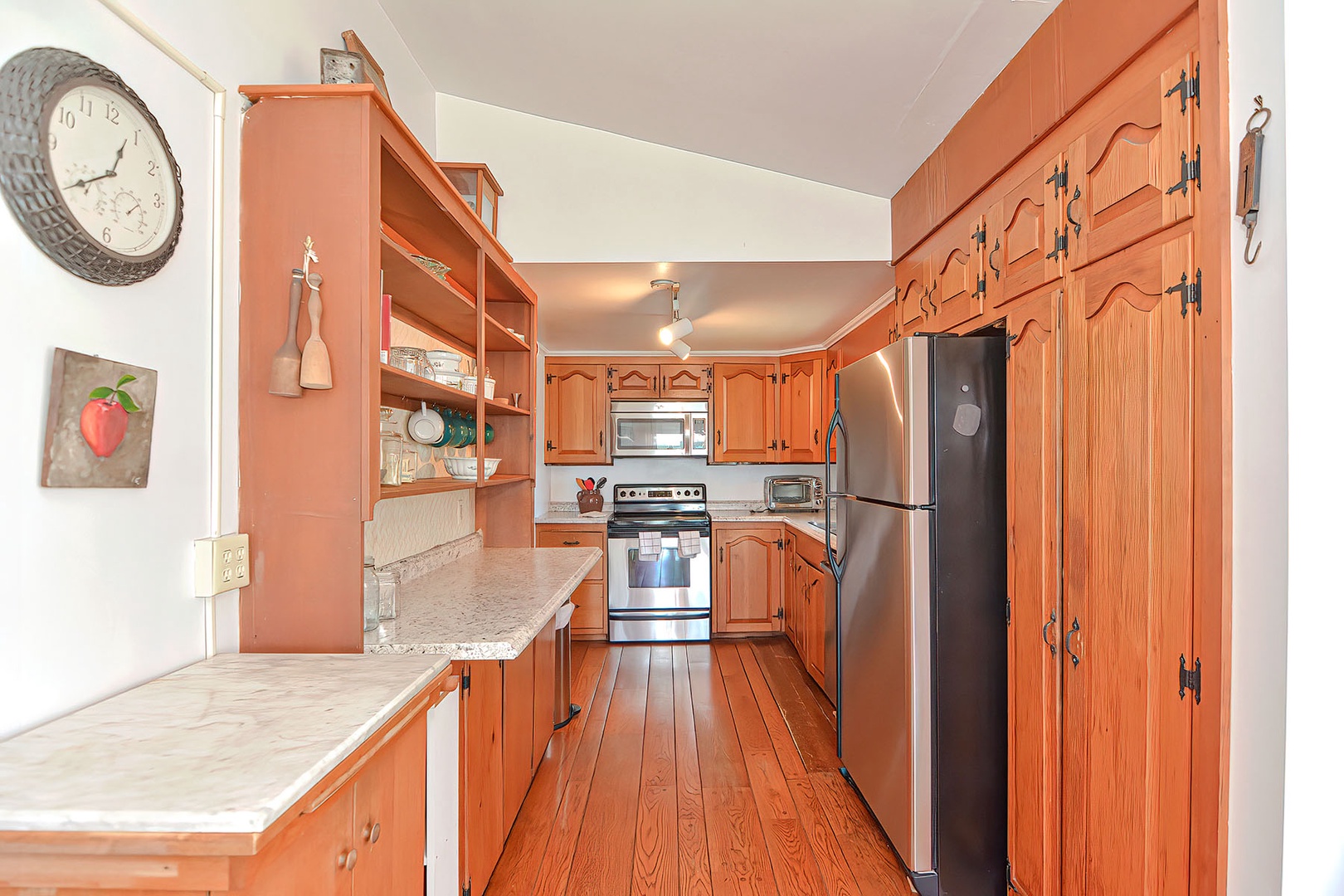 The kitchen, with pine cabinetry.
