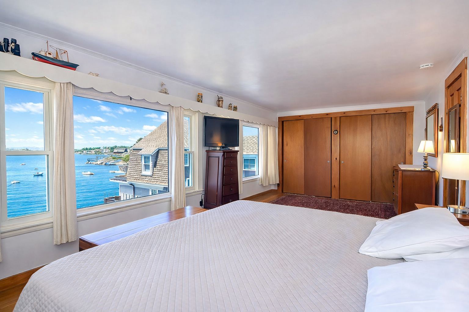 BR 2: Primary bedroom with a King bed and water views.