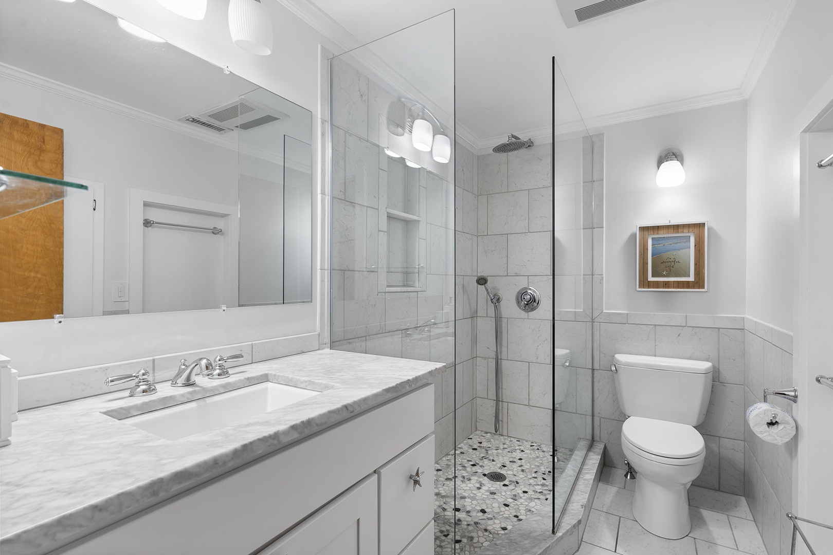 Full bathroom in the upper floor with a walk-in shower.