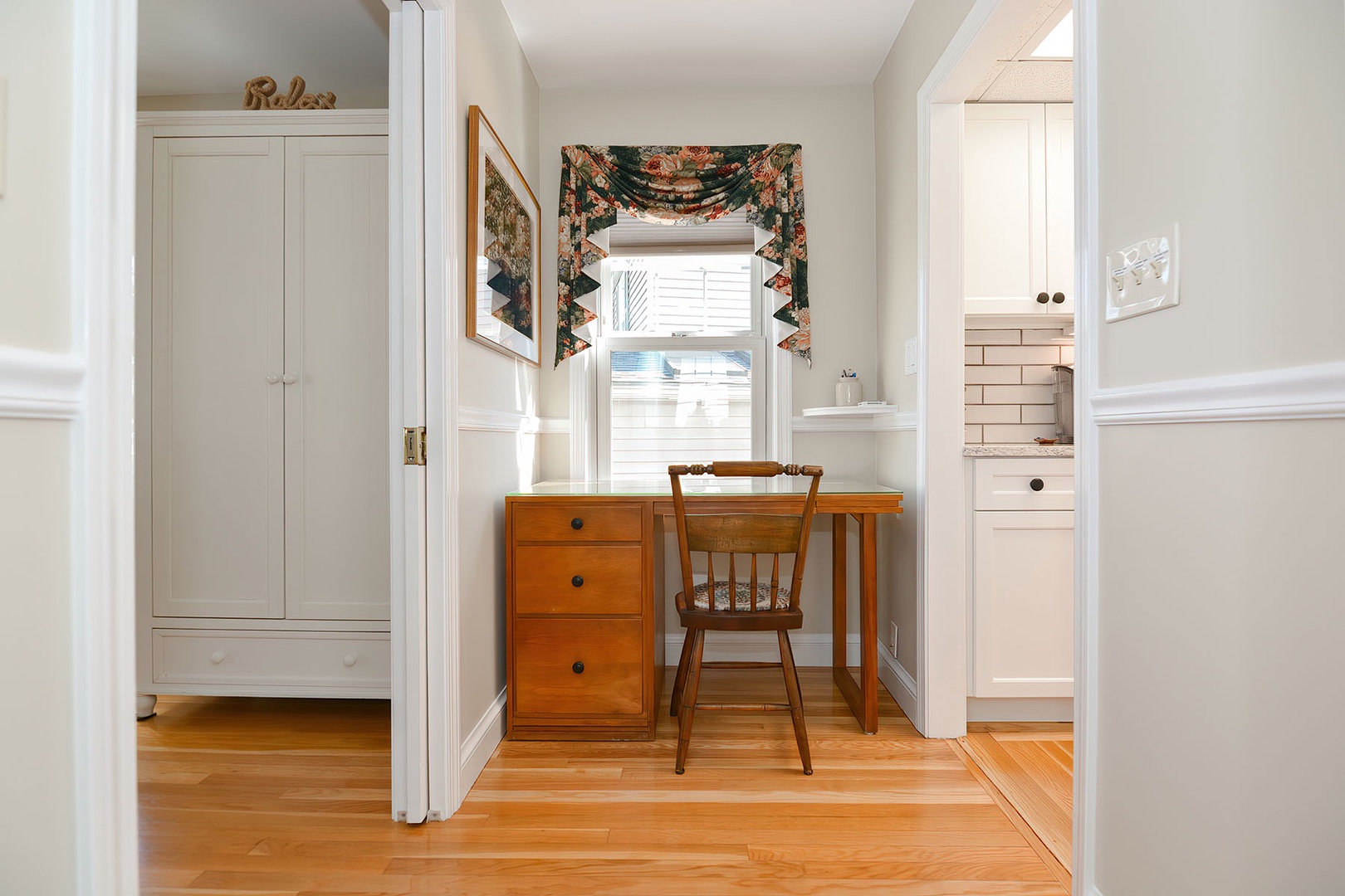 The workspace is located between the living room and the kitchen.