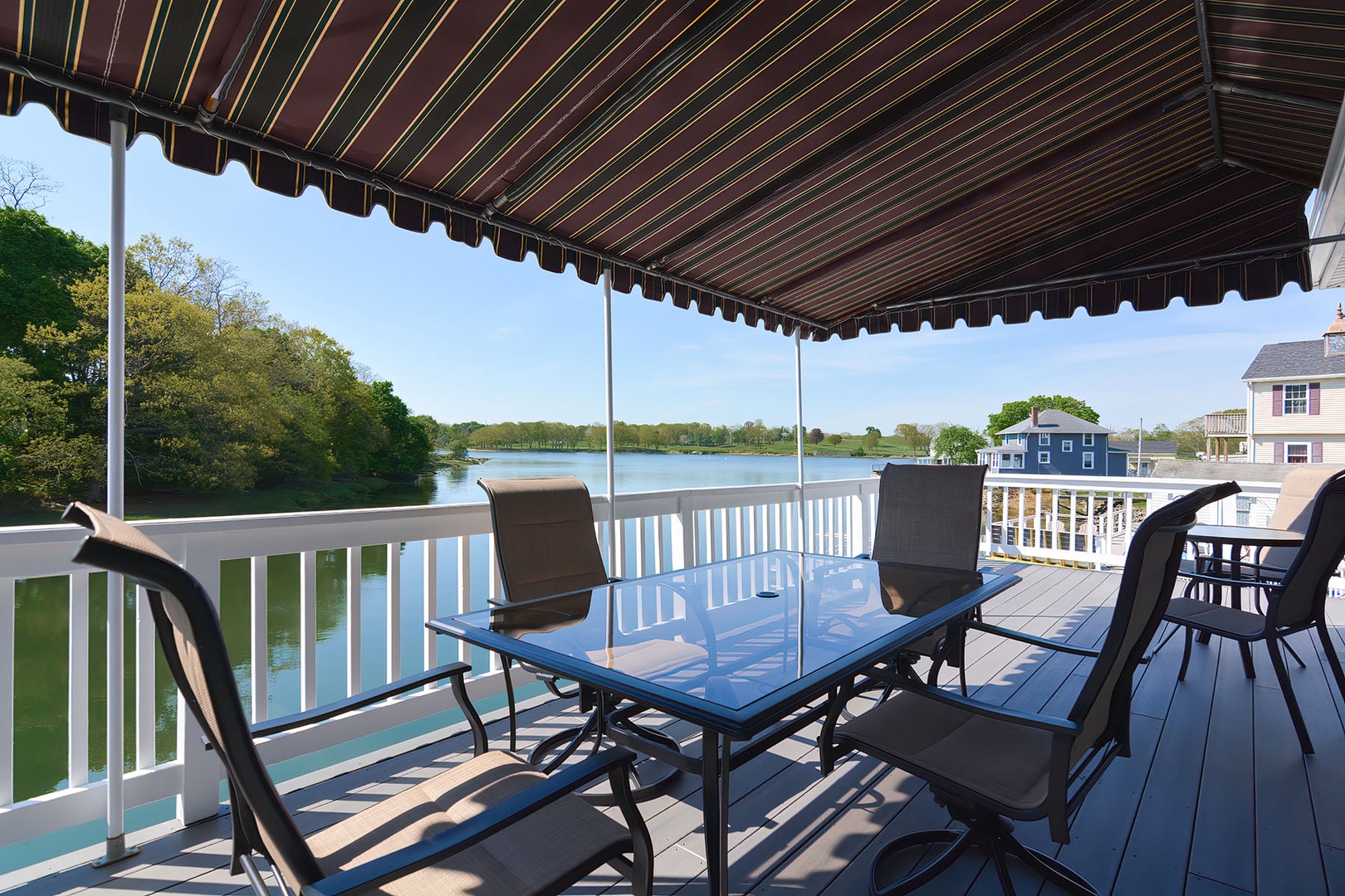 Outdoor dining area with beautiful views of the Crane River.