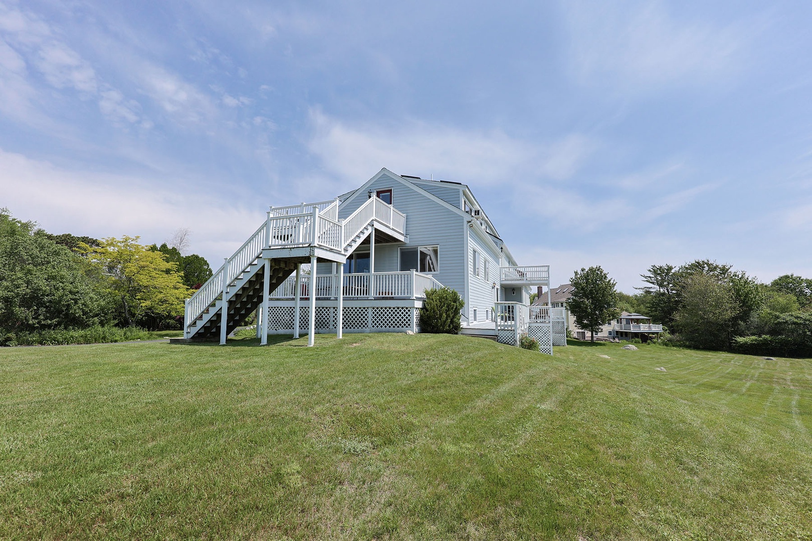 Rear view with yard and deck.