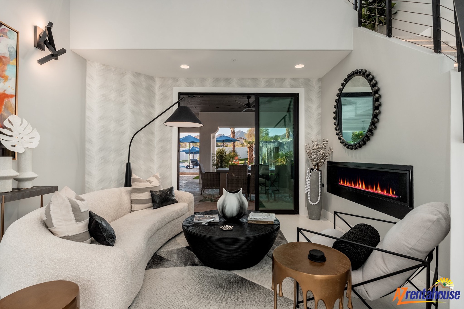 Unwind in your stylish living space featuring a cozy fireplace and seamless indoor-outdoor flow to your private patio.