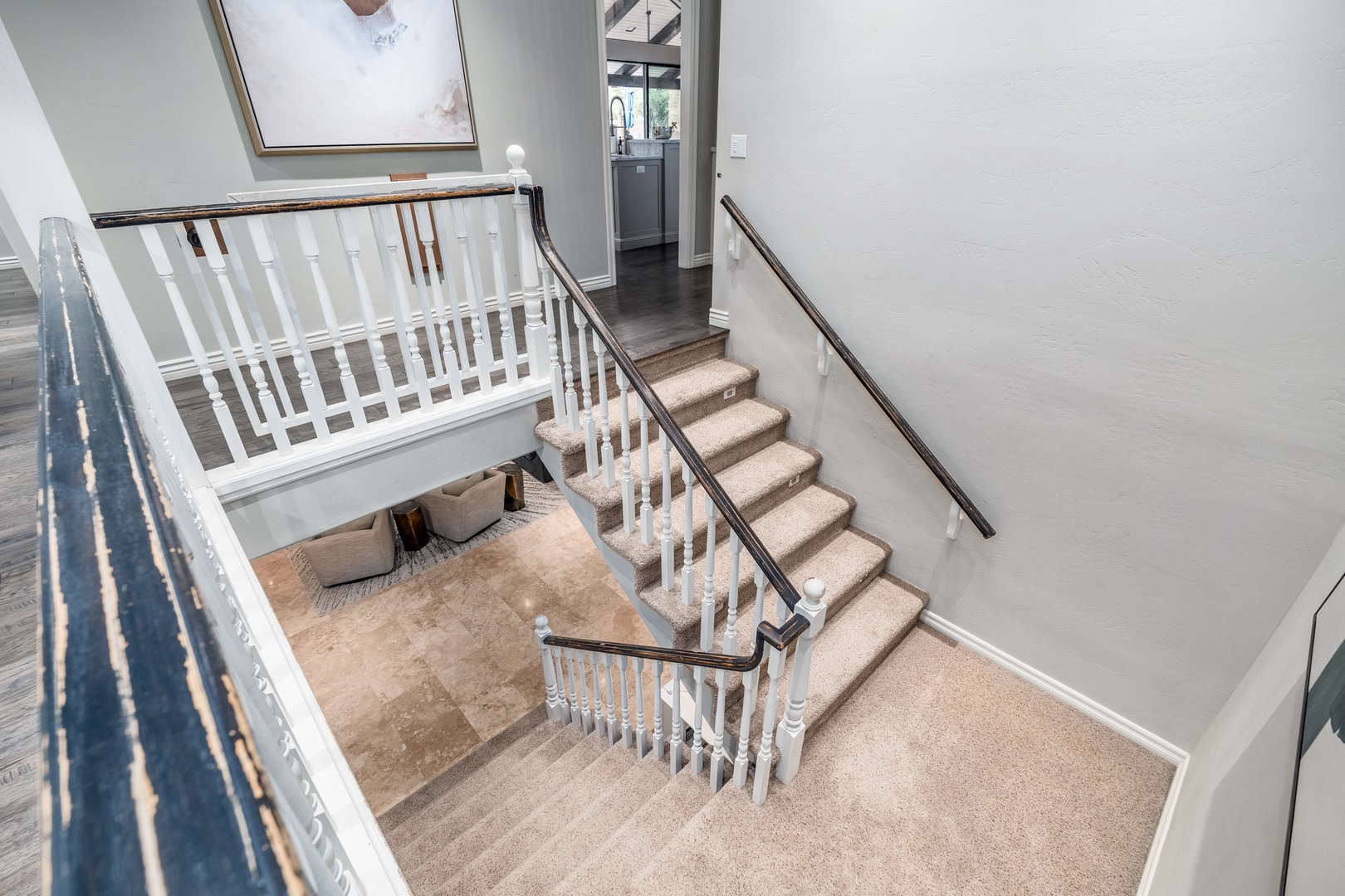A bright, elegant staircase connects your floors with natural light flooding in from above, inviting you to explore every corner of your home away from home.