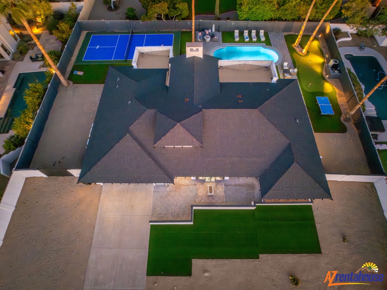 Stunning aerial view showcases this property's exceptional amenities including tennis court, swimming pool, and beautifully landscaped grounds.