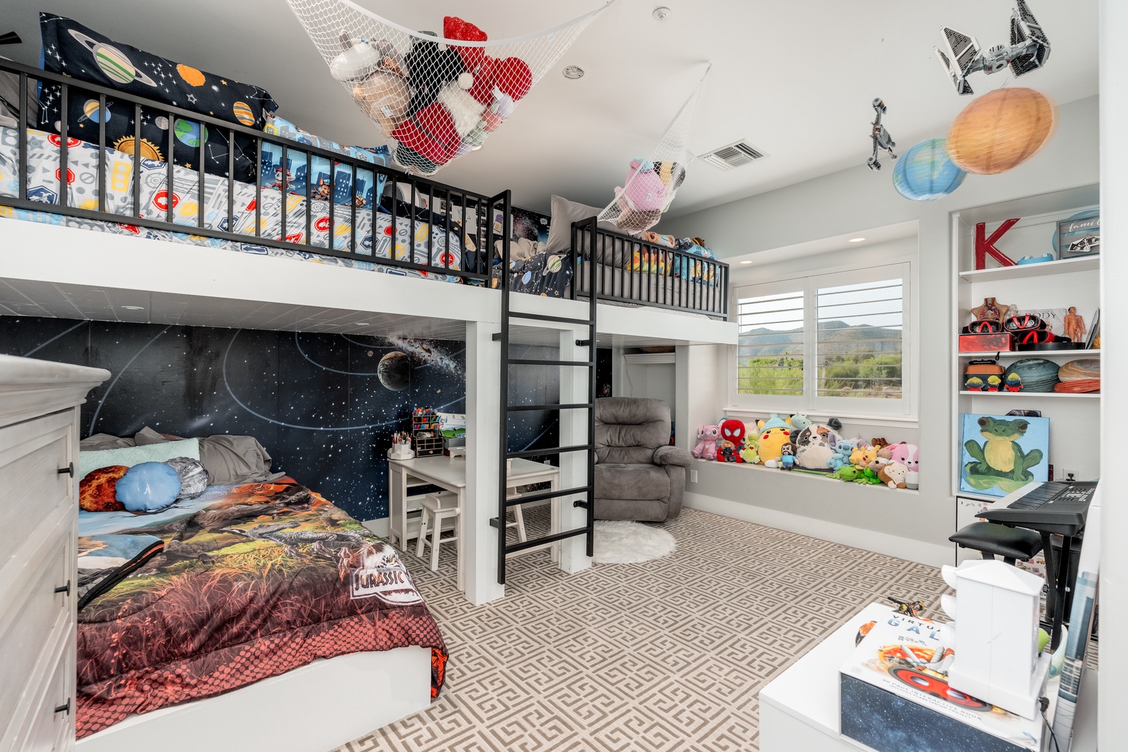 Your little explorers will dream among the stars in this enchanting space-themed room with cozy bunk beds, fun play areas, and whimsical décor that sparks imagination.