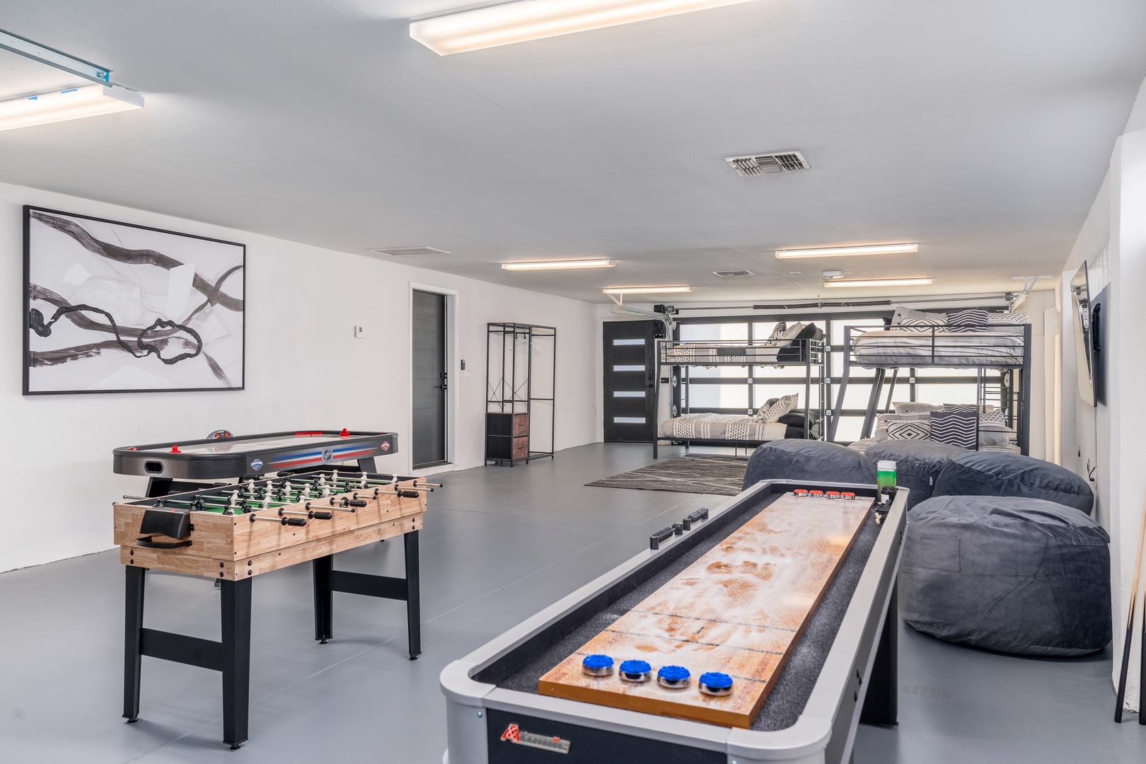 Your ultimate game room awaits! Challenge friends to foosball, air hockey, or shuffleboard, then unwind on plush seating. Bunk beds nearby let late-night fun turn seamlessly into restful sleep.