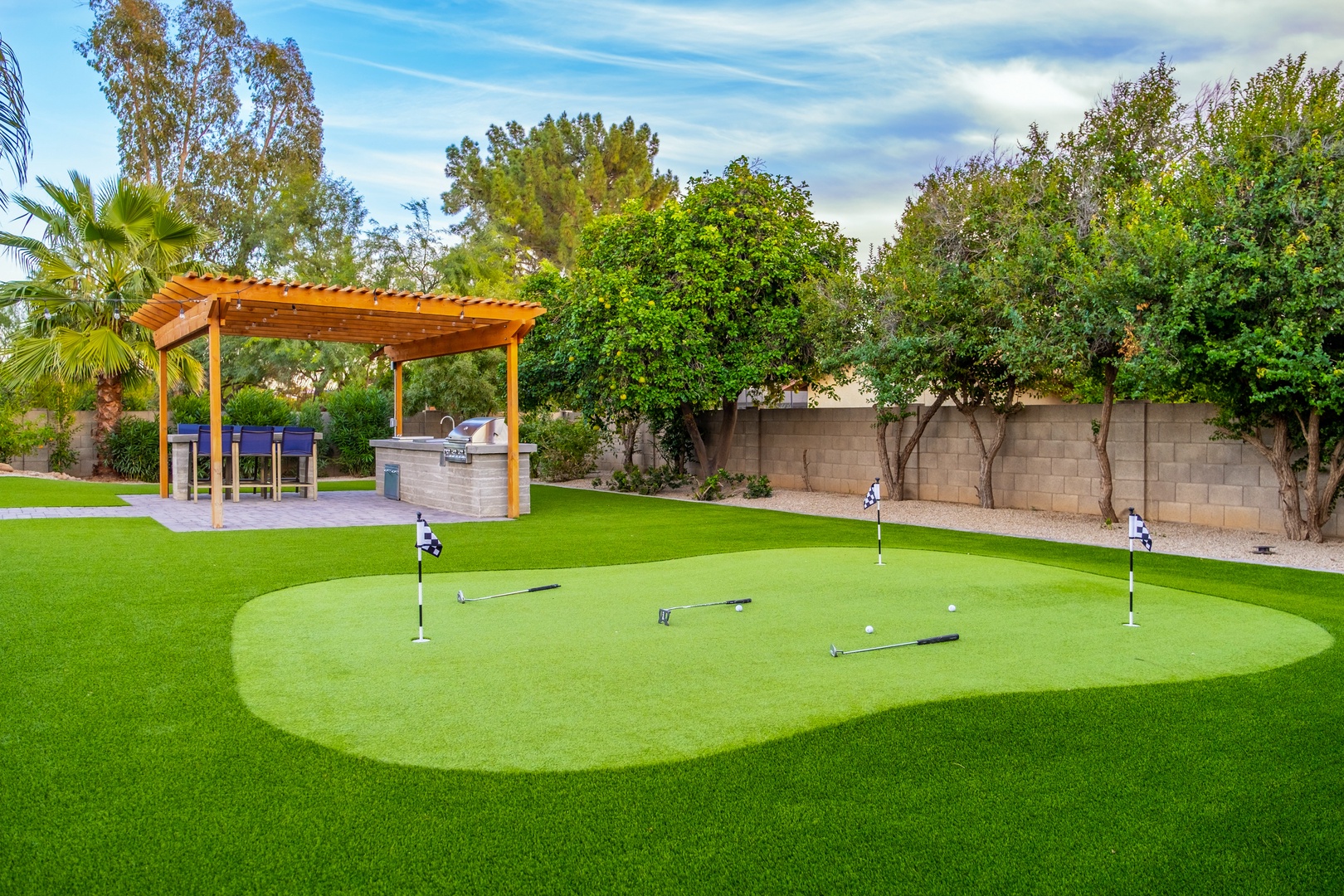 Practice your putting on a private green, then unwind at the covered outdoor dining and BBQ area, surrounded by mature trees and lush landscaping.