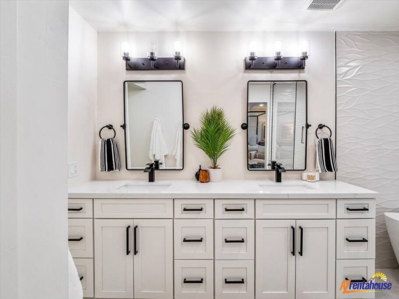 Pamper yourself in this spa-like bathroom with dual vanities, perfect lighting, and elegant touches that make your morning routine feel luxurious.