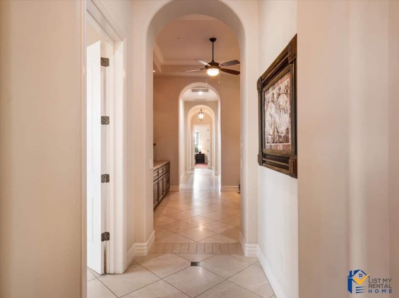 Step into your elegant hallway where soaring arched ceilings and warm lighting create a grand welcome home.