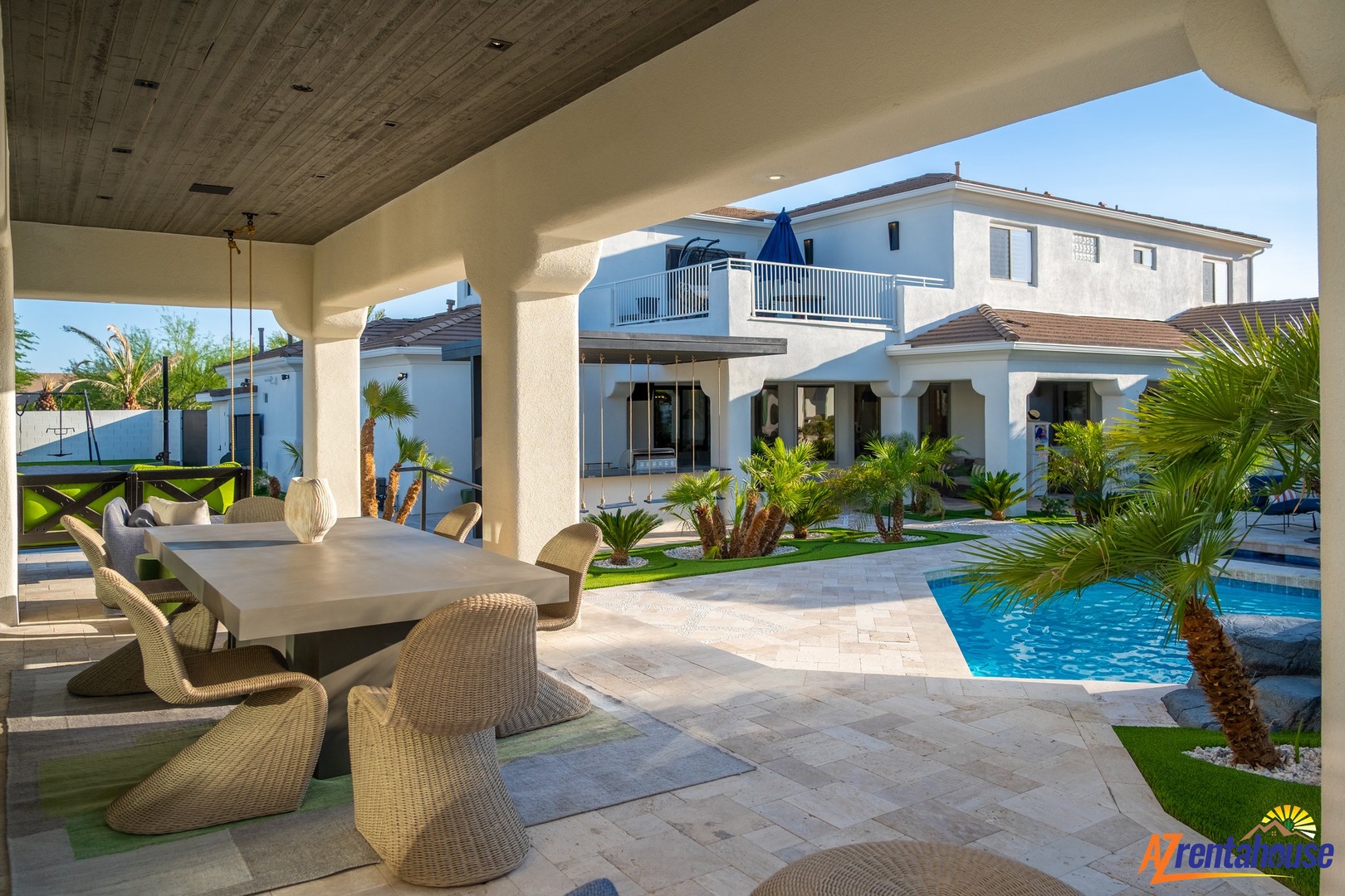 Dine al fresco under your covered terrace while enjoying views of the sparkling pool and tropical landscaping.