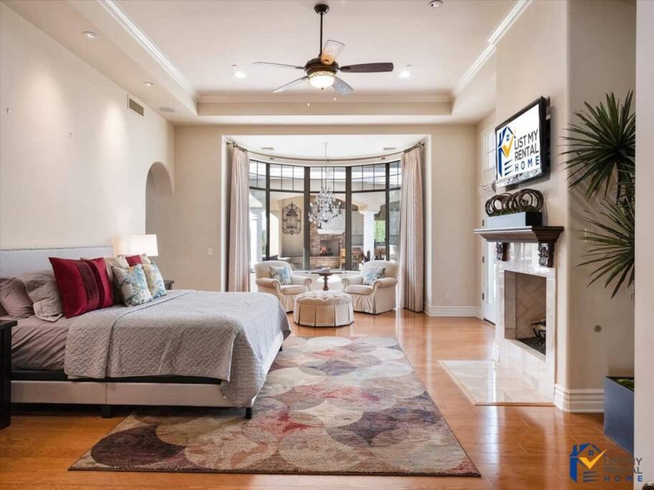 Your spacious master suite features gleaming hardwood floors, elegant furnishings, and a cozy fireplace for ultimate relaxation.