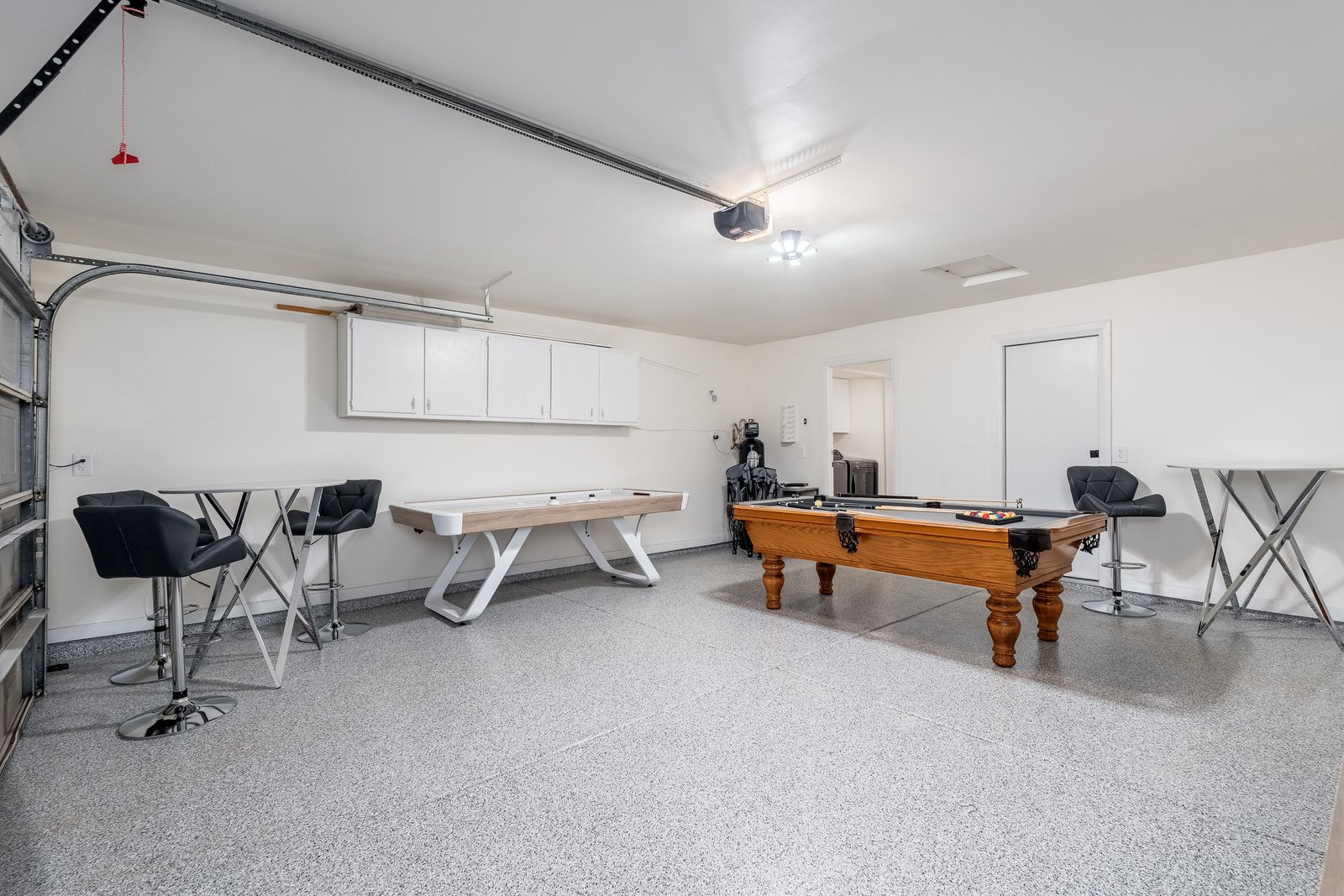 Step into your private game room with a beautiful pool table, high-top seating, and plenty of space to unwind with friends and family after a day of adventure.