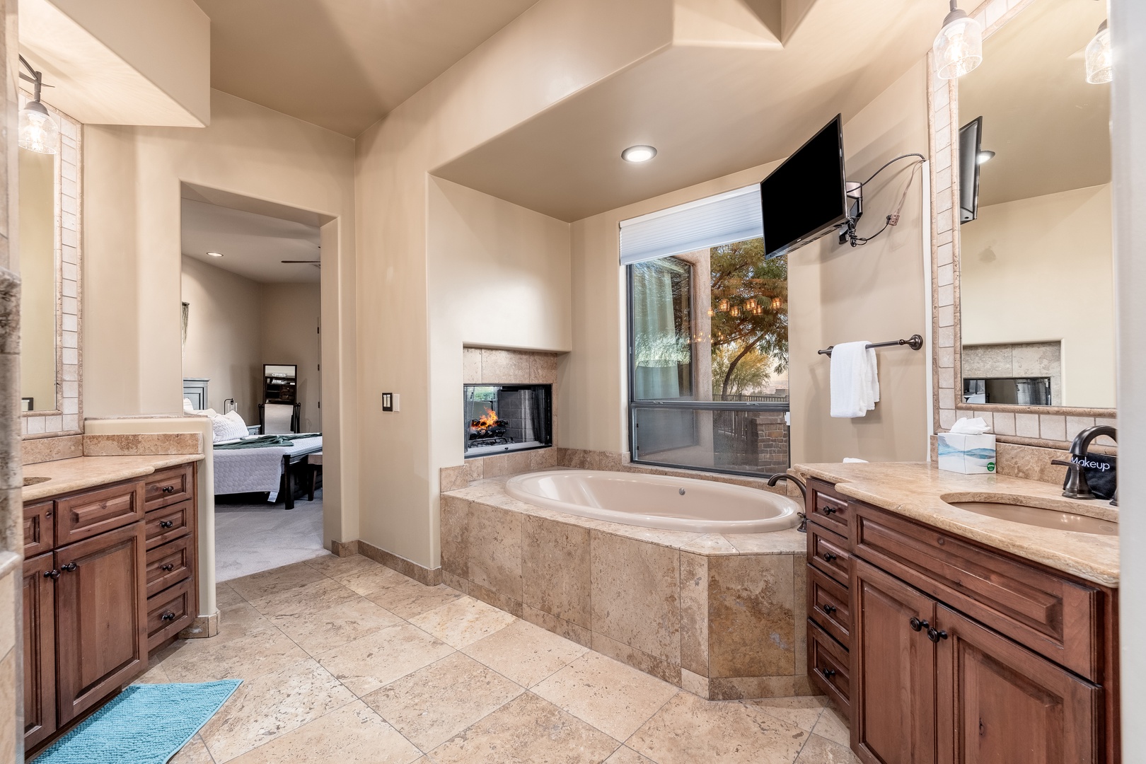 Slip into your private soaking tub and unwind by the warmth of the fireplace as natural light filters through the window.