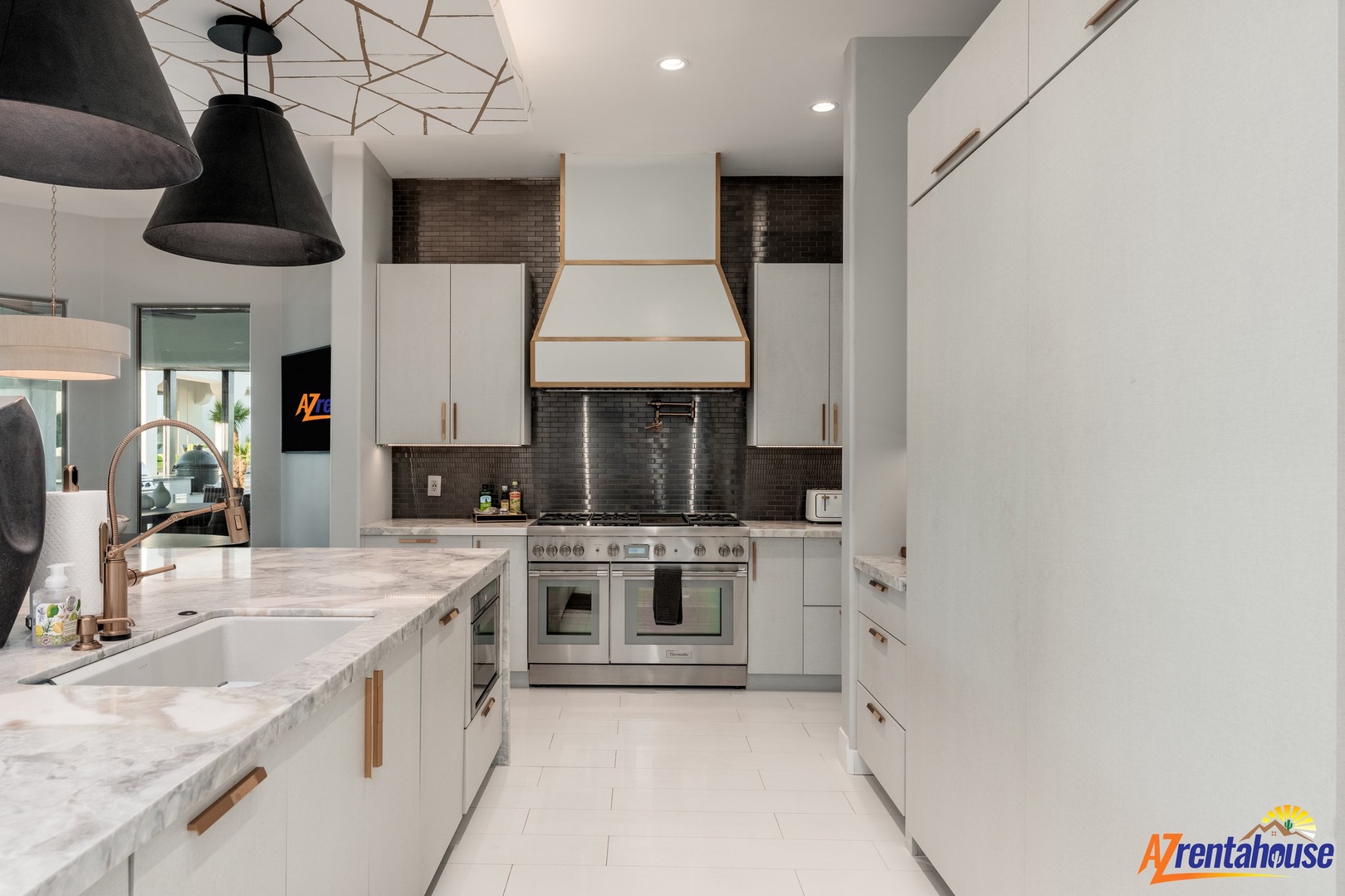 Your modern kitchen features sleek white cabinetry, marble countertops, and professional-grade appliances for all your culinary adventures.