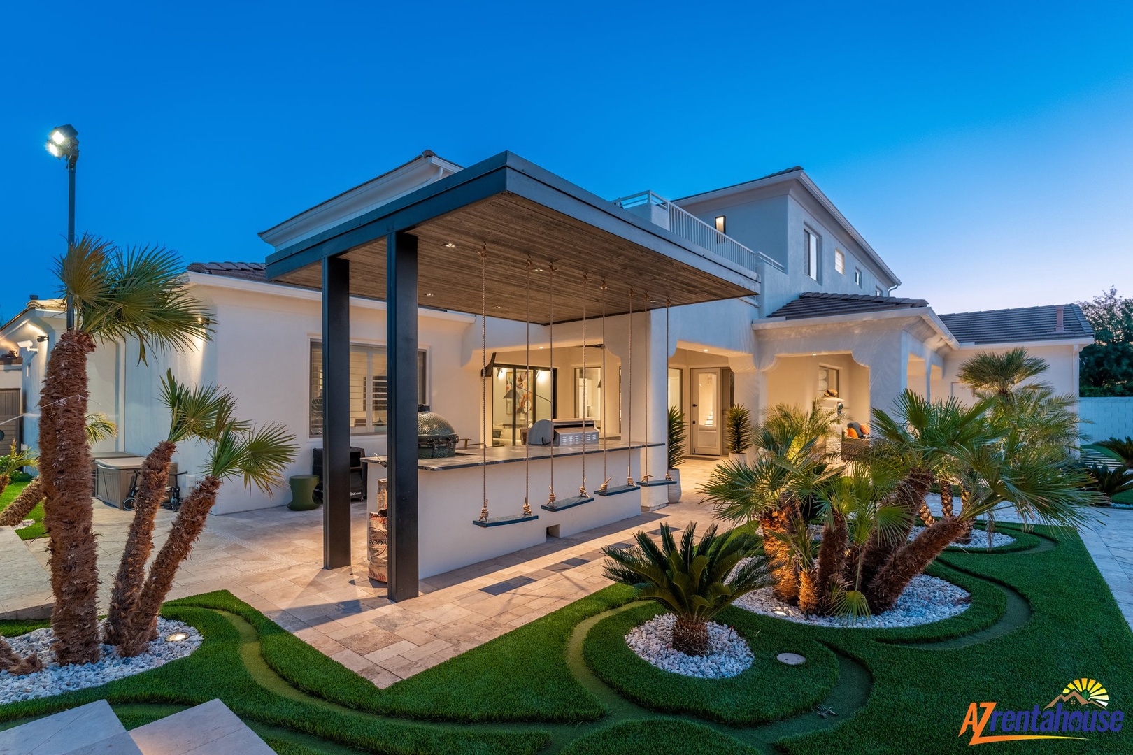 Modern luxury villa showcasing contemporary architecture with tropical landscaping and elegant outdoor entertaining spaces.
