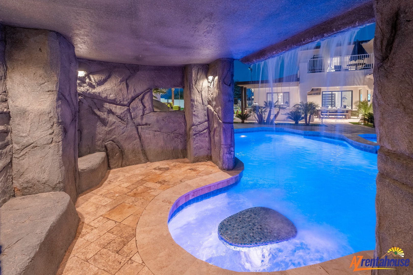 Dive into your private grotto-style pool, where dramatic stone walls and soothing blue lighting create an enchanting cave-like atmosphere for unforgettable evenings.