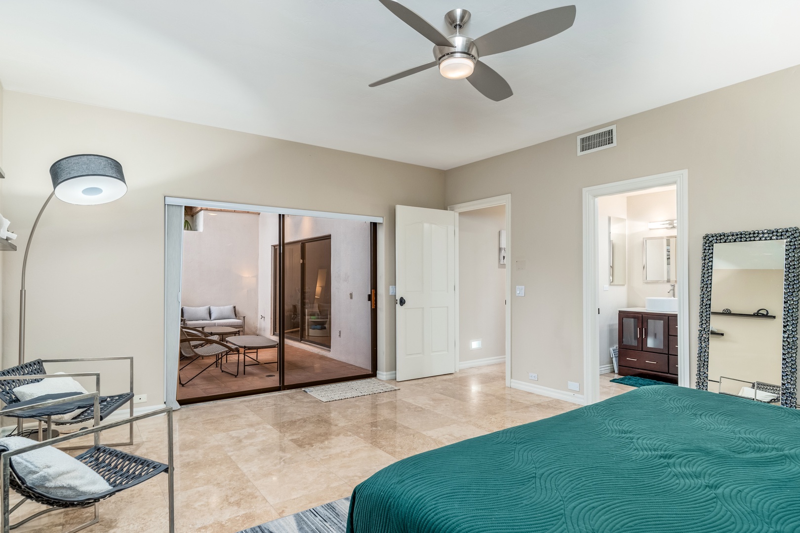 Your spacious bedroom opens onto a private outdoor retreat, with soft lighting and modern finishes creating a serene escape for ultimate relaxation.