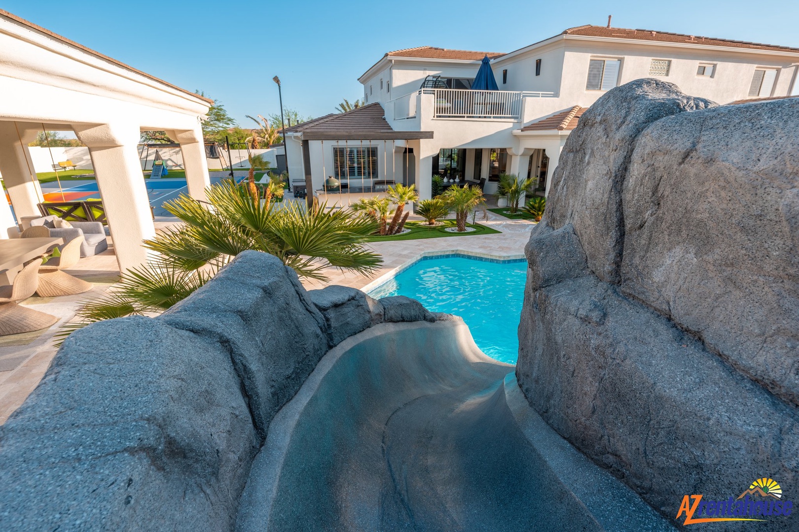 Stunning villa with unique rock-feature pool and tropical landscaping in a peaceful resort setting.