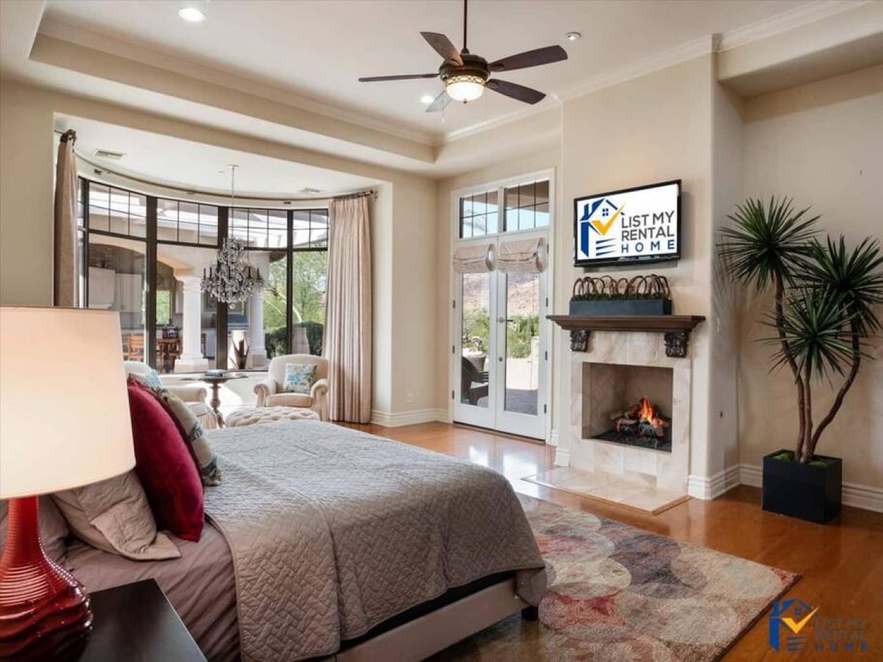 Unwind in your elegant bedroom with cozy fireplace, private patio access, and sophisticated furnishings for the perfect romantic retreat.