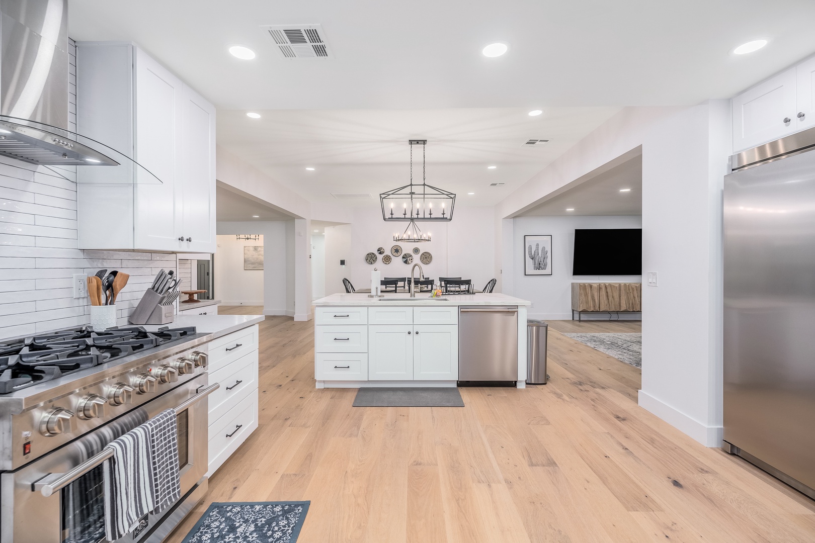 Your gourmet kitchen awaits with gleaming stainless appliances, spacious countertops, and an open layout flowing seamlessly into the dining and living areas—perfect for cooking and gathering.