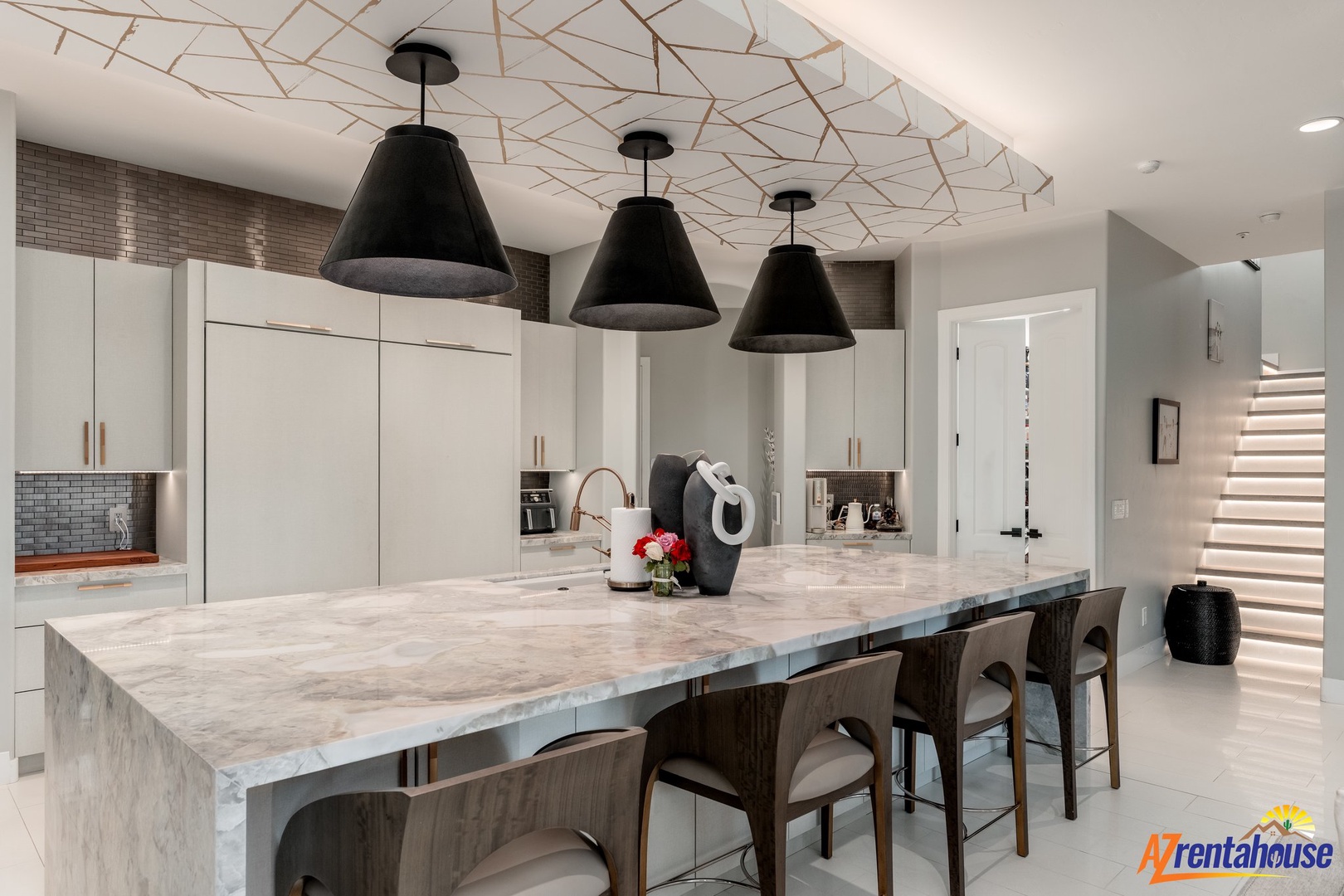 Your sleek marble kitchen island becomes the heart of your stay, where morning coffee and evening conversations flow naturally.
