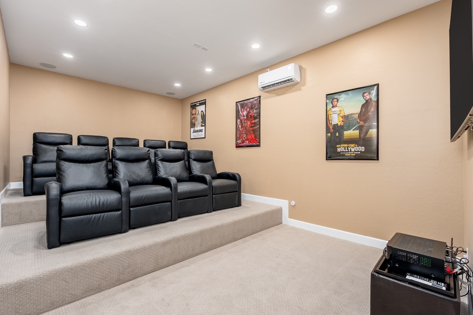 Your private home cinema features plush reclining seats and a state-of-the-art sound system, perfect for movie nights or binge-watching your favorite series in total comfort.