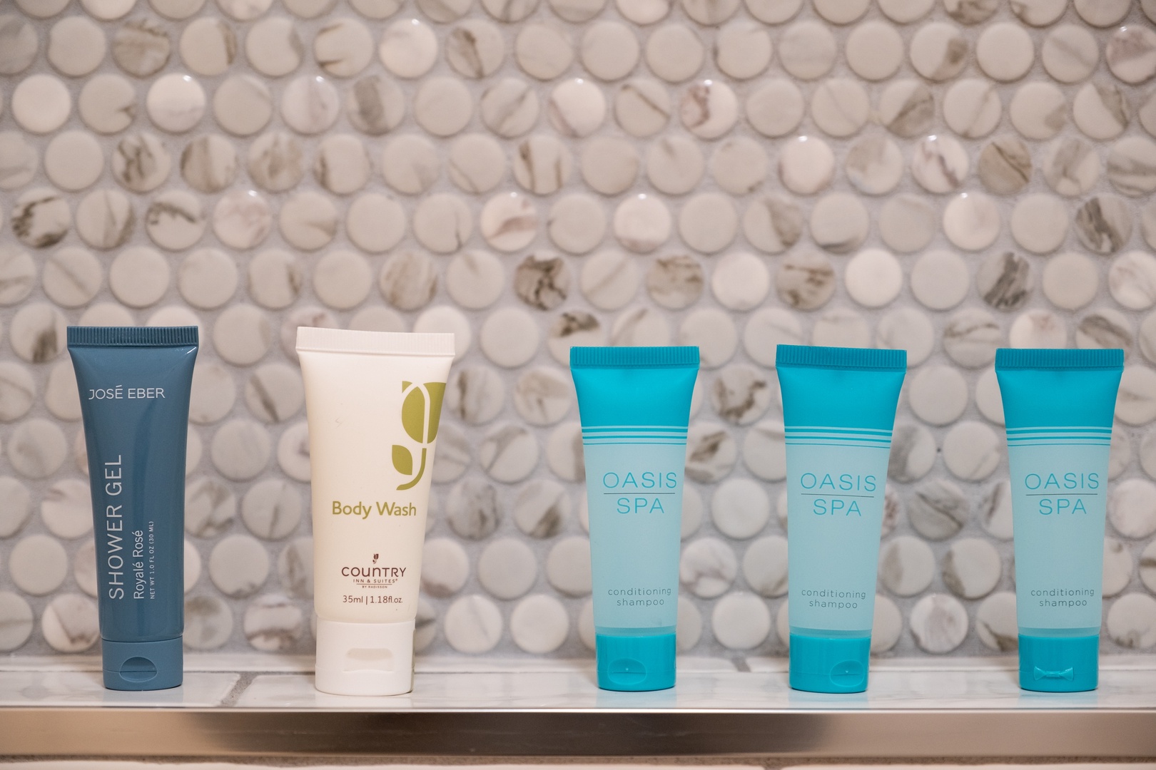 Refresh with premium toiletries thoughtfully arranged in your private bathroom, featuring quality brands like José Eber and Oasis Spa for a spa-like experience.