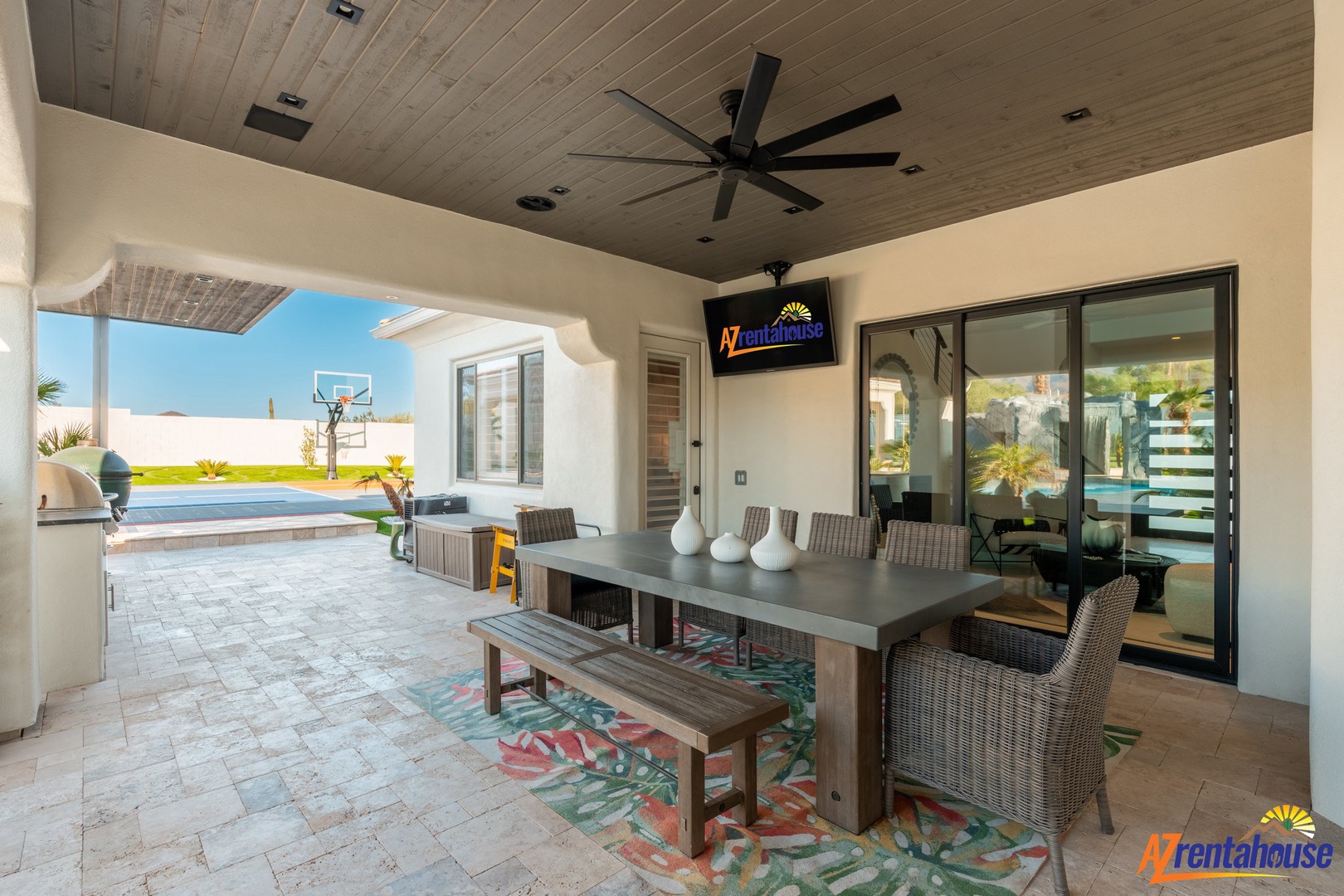 Enjoy alfresco dining in your private covered patio, with pool views and tropical breezes from the ceiling fan overhead.