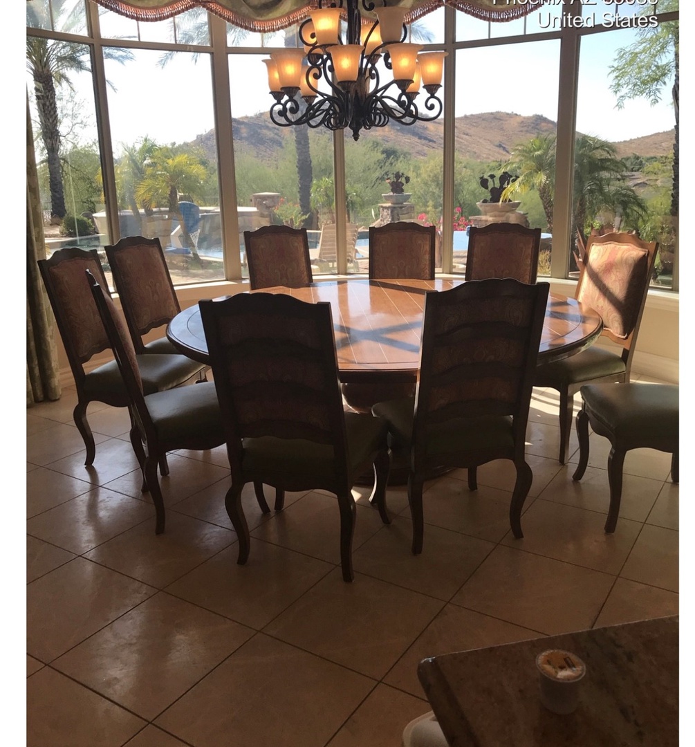 Gather around this elegant dining table for memorable meals with mountain views through floor-to-ceiling windows.