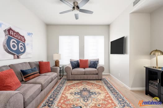 Relax in your stylish living space with cozy sectional seating, vintage Route 66 charm, and modern entertainment ready for your stay.