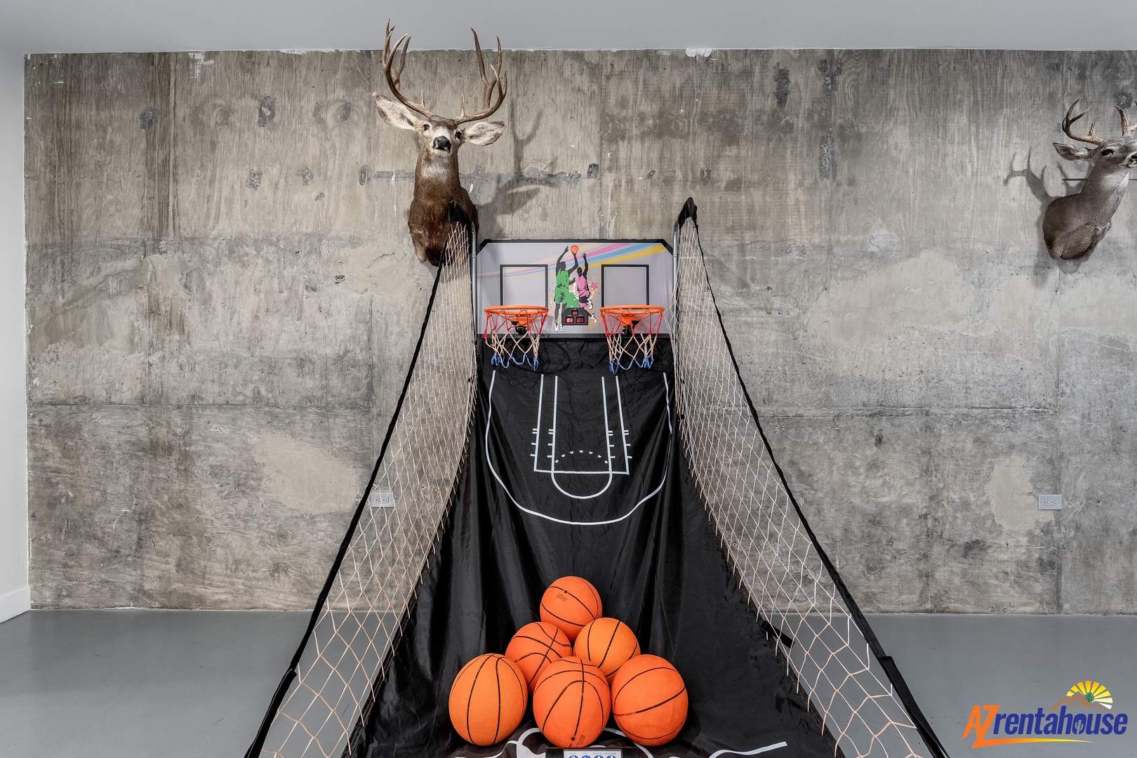 Challenge friends to basketball in your game room, where rustic wall décor meets playful competition.