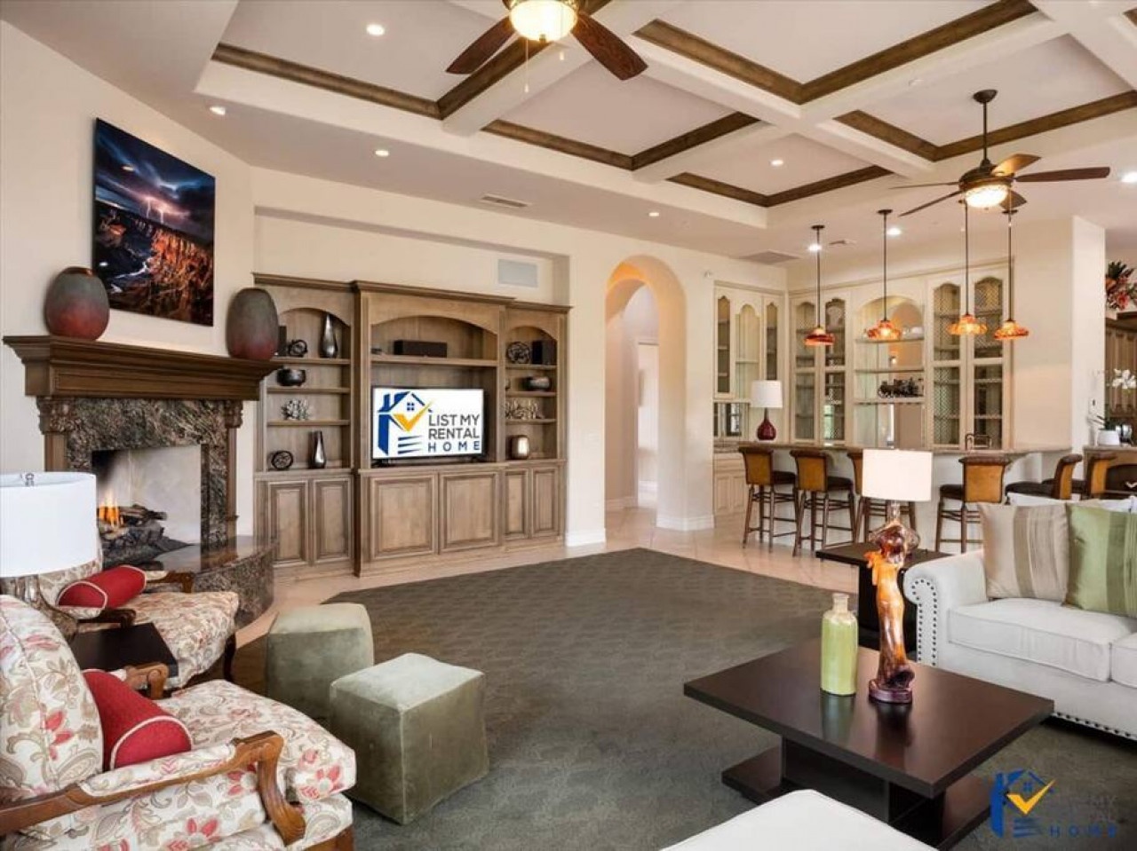 Unwind in your elegant living space with soaring coffered ceilings, a cozy fireplace, and seamless flow to the gourmet kitchen.