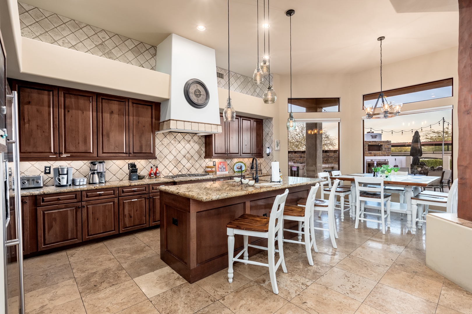 Your spacious kitchen invites culinary adventures with rich wood cabinetry, granite counters, and a center island perfect for morning coffee or meal prep together.