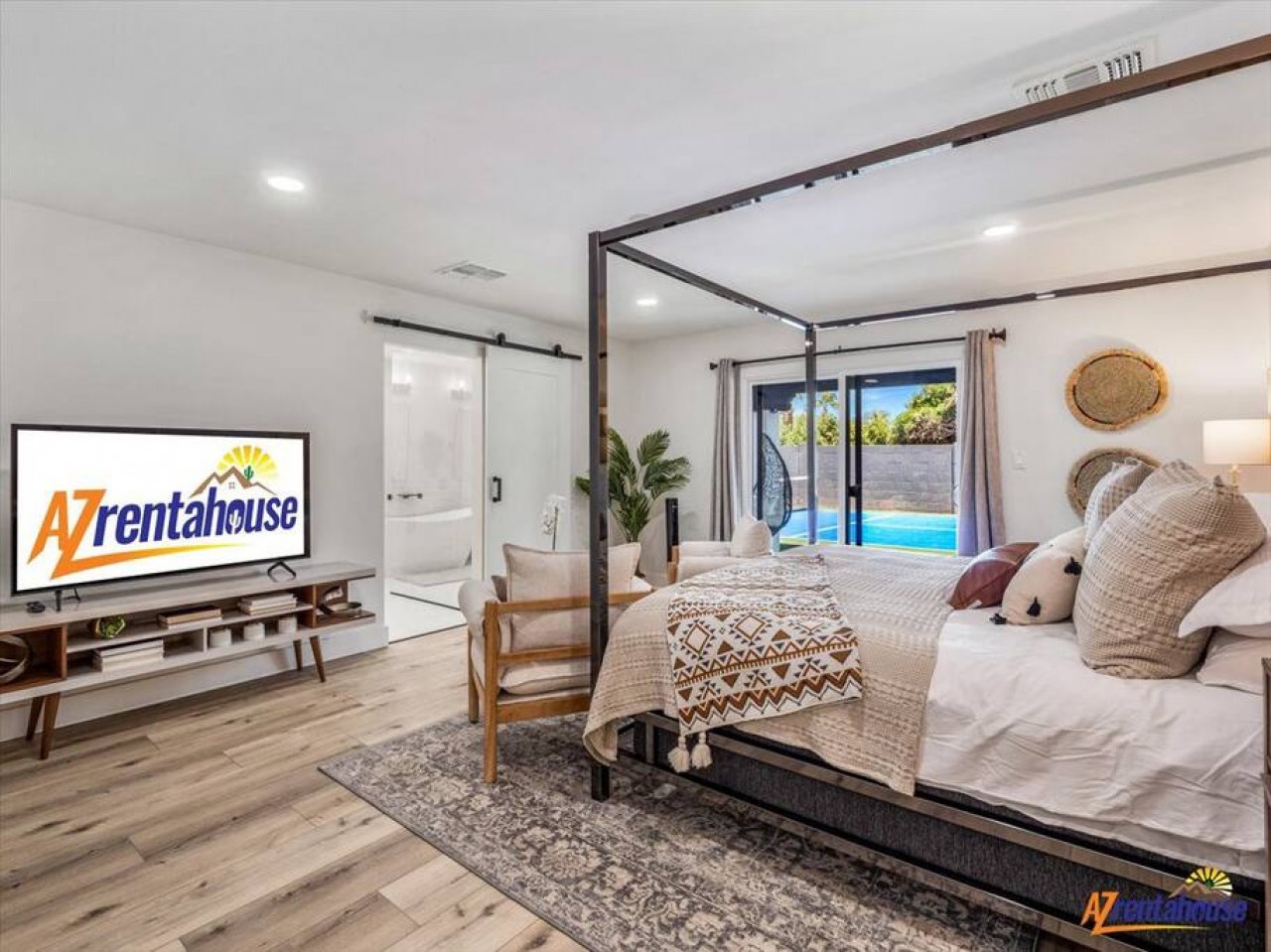 Drift off in your elegant canopy bed while enjoying poolside views through floor-to-ceiling windows and modern amenities.