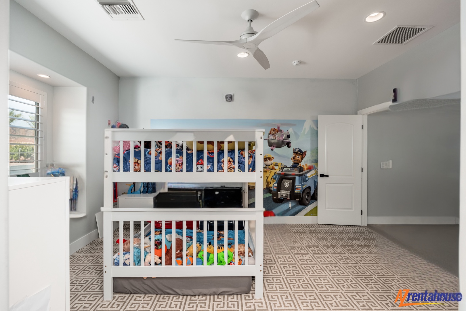 Your little adventurers will love this bright, cheerful bedroom with fun bunk beds and playful wall art that sparks imagination.