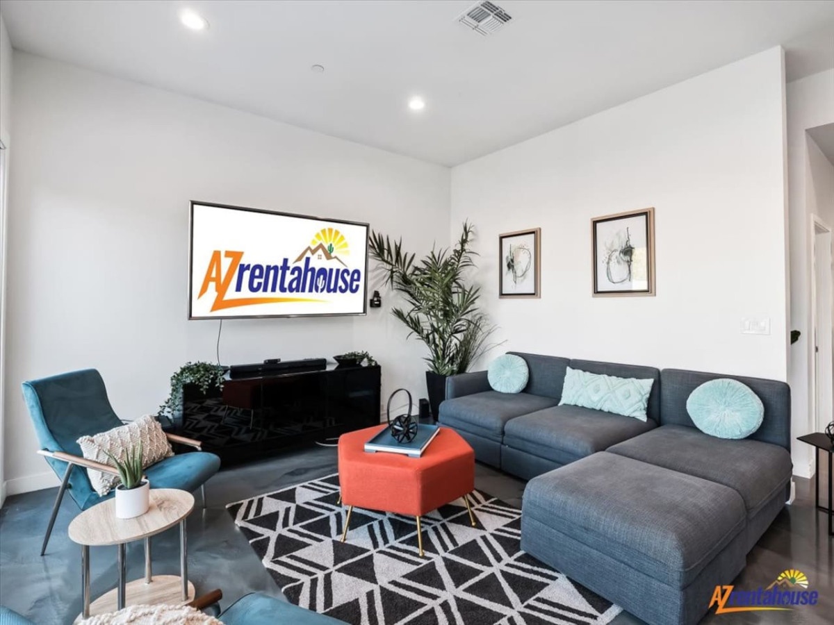 Unwind in your stylish living room with plush sectional seating, vibrant decor, and modern entertainment setup for perfect relaxation.